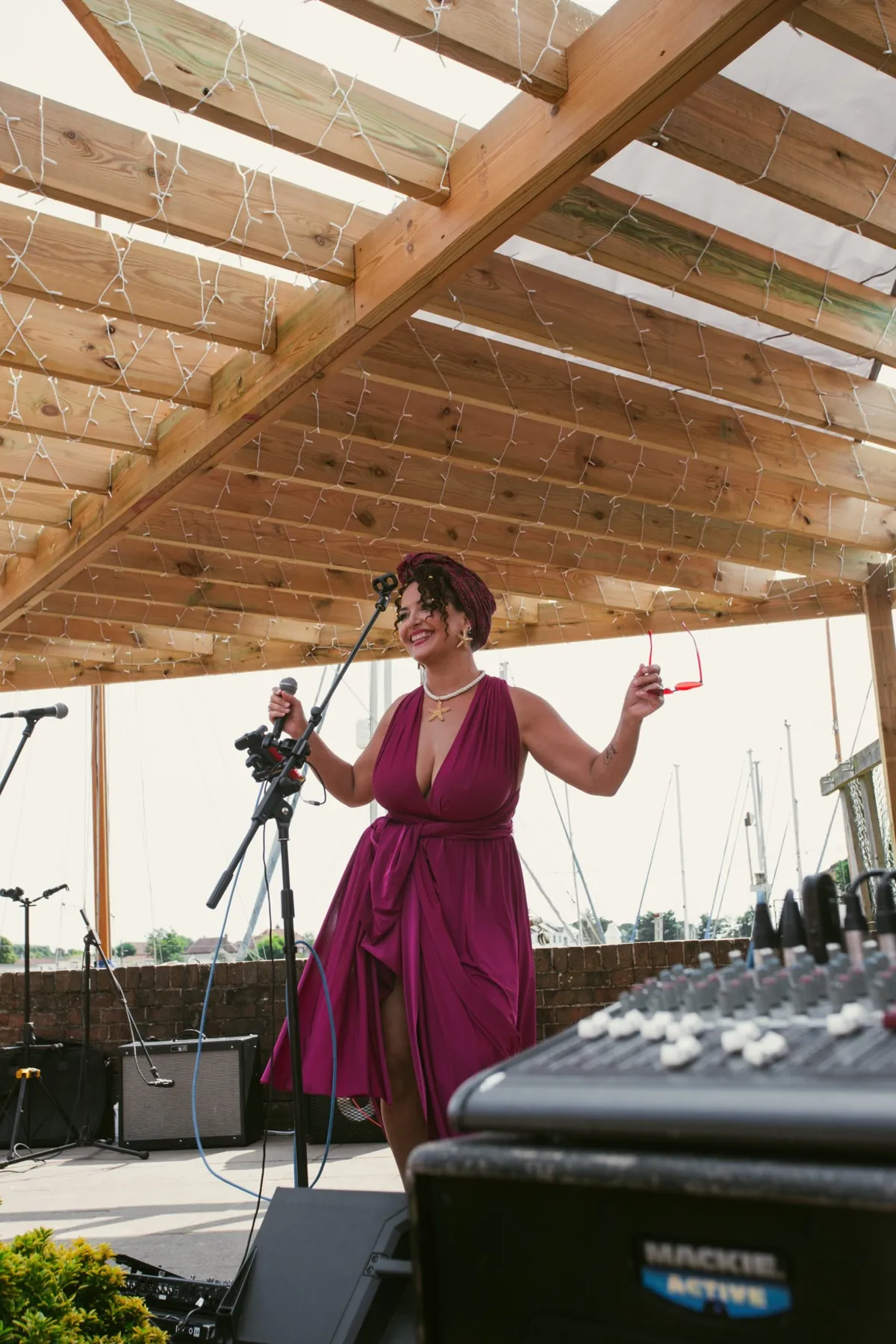 A singer performing in the waterside garden at The Lord Raglan